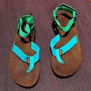 Teva Sandals.  Size 8.  Never worn. Blue and green color.